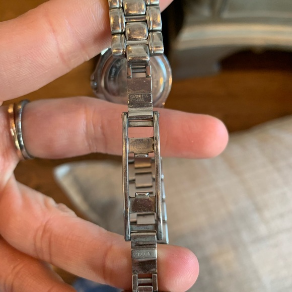 Movado woman’s watch. Black face. Stainless steel